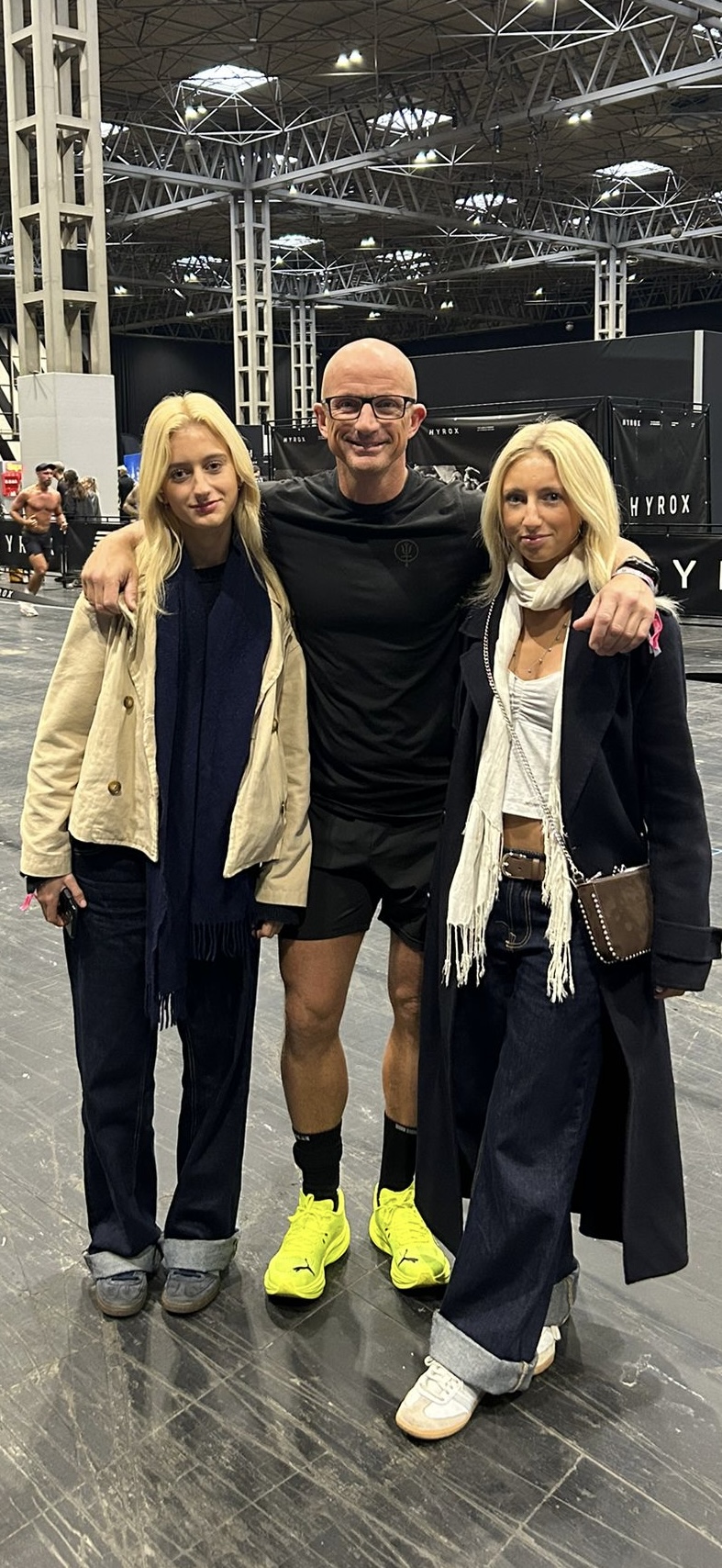 Rob Cooke with his daughters at a HYROX fitness event